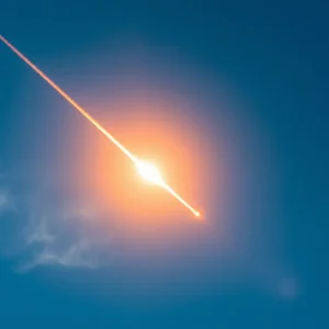 Fireball meteor streaking across a blue sky