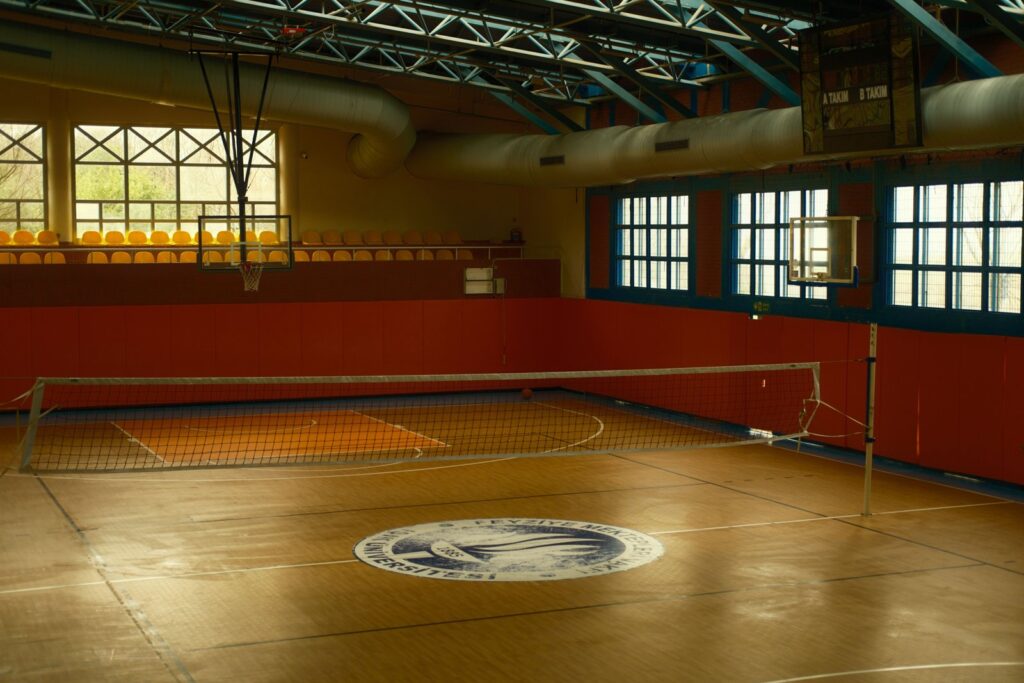 Indoor volleyball net on empty gym court