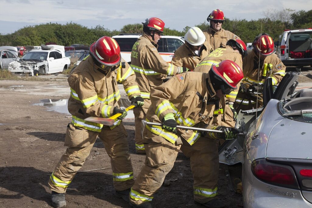 Firefighters in turnout gear working through a training exercise