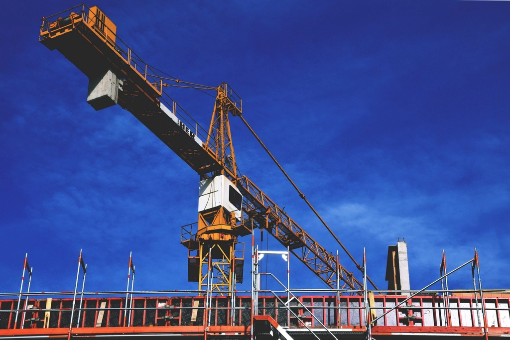 Construction cranes over a building site